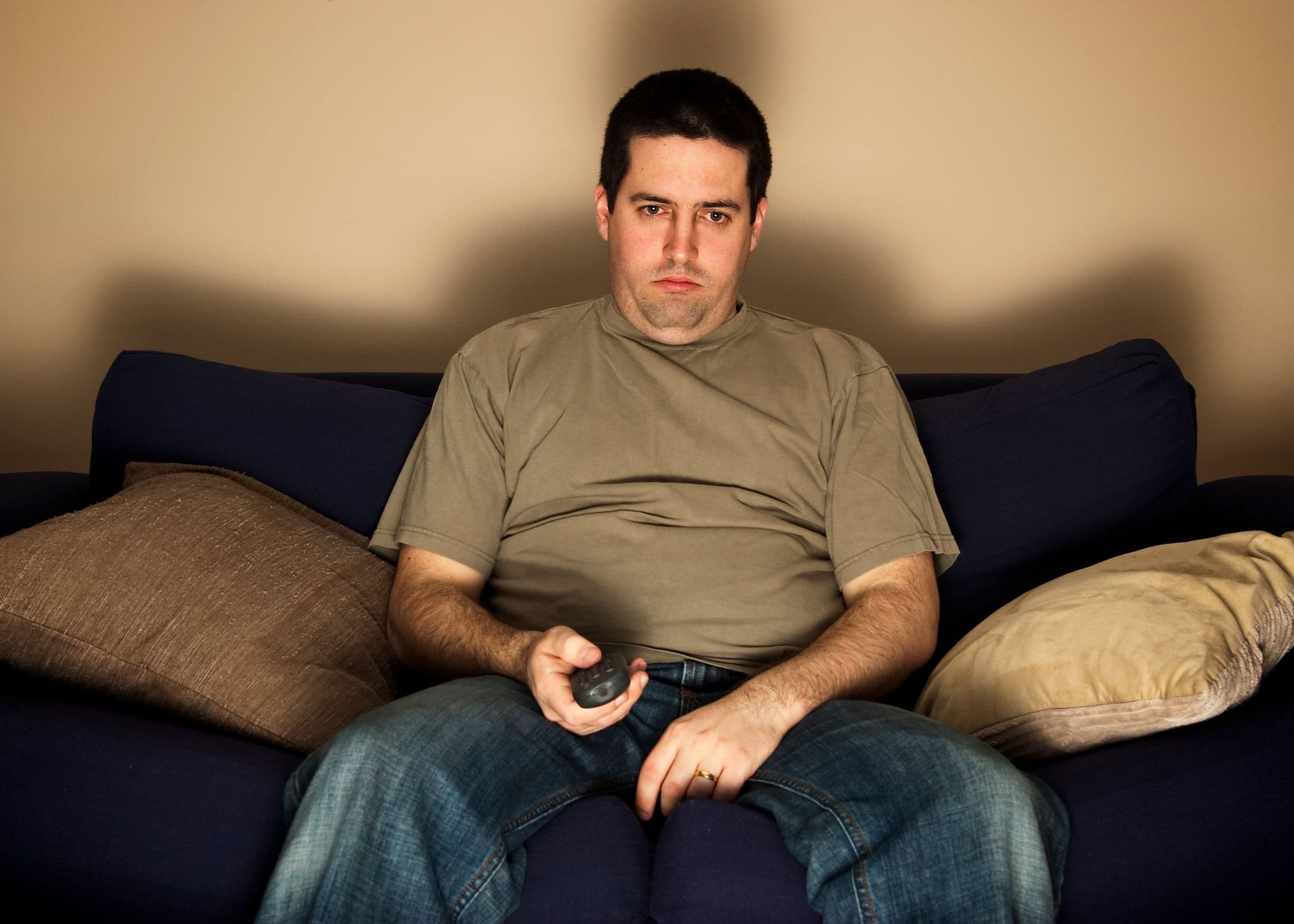 Sedentary man in front of the TV