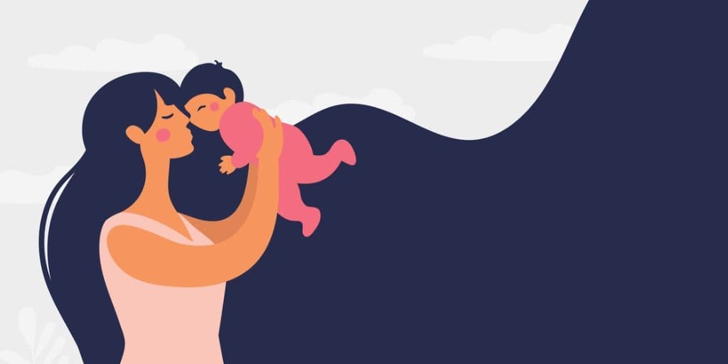 Glad kvinde der holder en lille baby