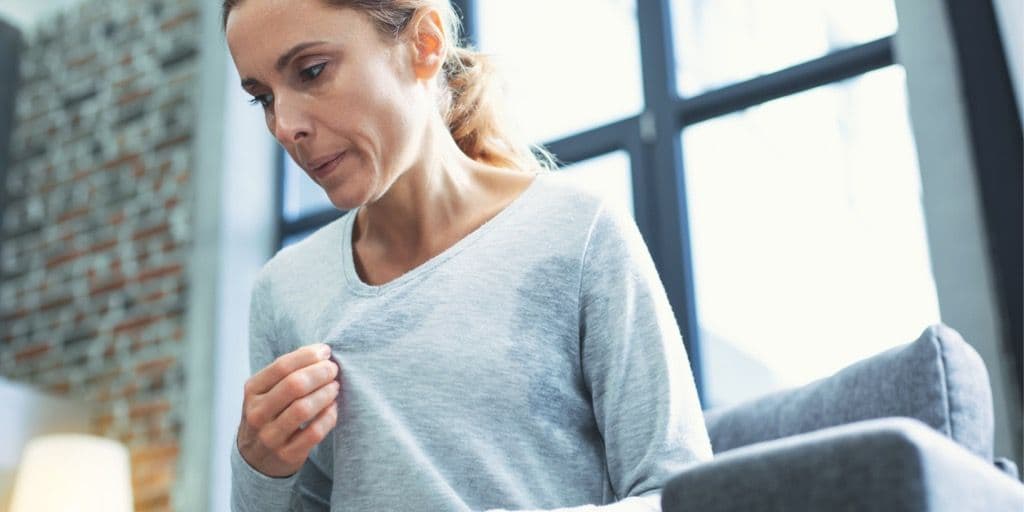 Menopausal woman having hot flashes