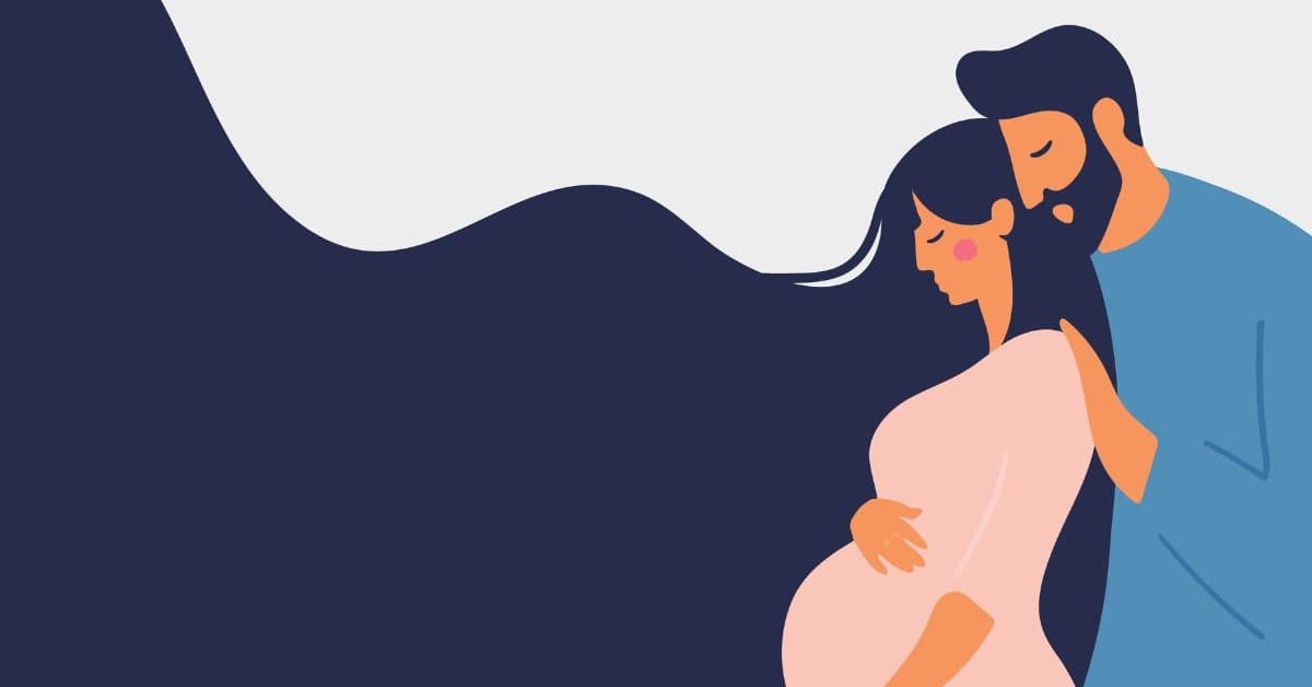 Raskaana oleva nainen, jota hänen mieskumppaninsa syleilee